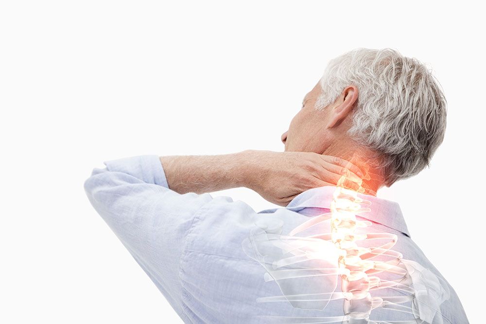 Man experiencing neck pain with highlighted spine, suggesting discomfort or medical condition.