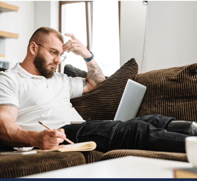 man reviewing his disability claim on his laptop
