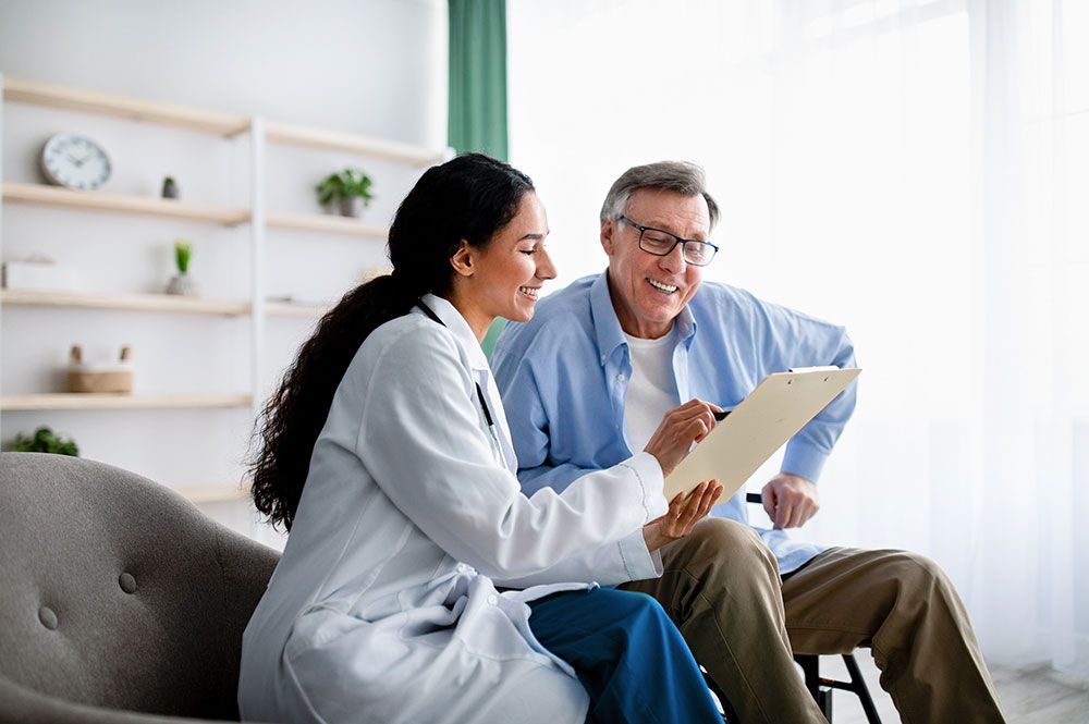 female physician talking to a male patient