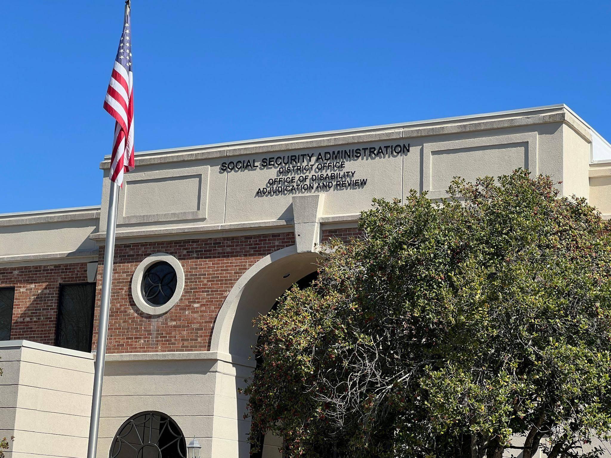 an american flag flying in front of a building