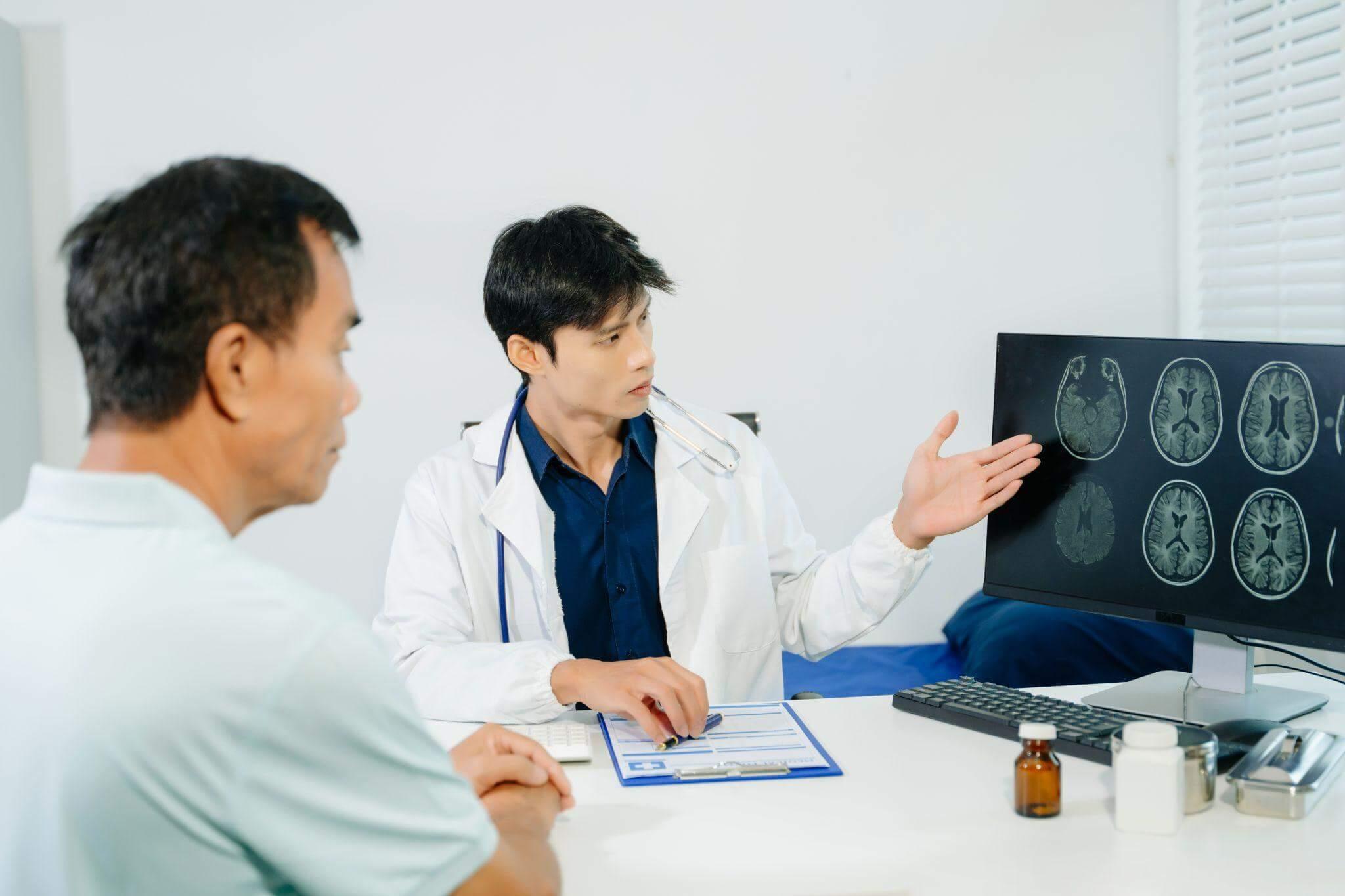 Doctor discusses x-ray results with patient regarding